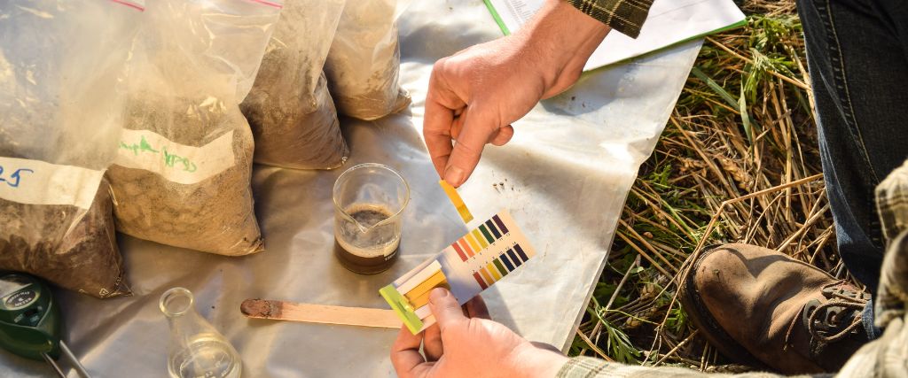 Arborist from Aspen Tree in northern New Jersey performing a soil test for pH level.