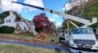 The Aspen Tree Service crane removing a fallen tree that damaged a Northern New Jersey home after a severe storm.